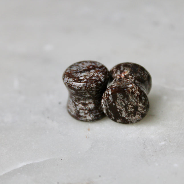 These Double Flare Brown Snowflake Obsidian Plugs bring together natural stone beauty and meaningful energy—perfect for everyday wear, spiritual practice, or anyone seeking balance with a striking, earthy edge.
