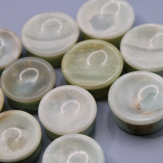 A beautiful pair of Natural Calcite stone plugs, hand-carved and polished into a smooth double flare shape for a secure and comfortable fit. These ear gauges showcase the soft, luminous quality of calcite, with creamy whites, warm honey tones, and subtle translucency that varies from piece to piece. Each plug highlights unique natural banding and organic patterns, making every pair one-of-a-kind.