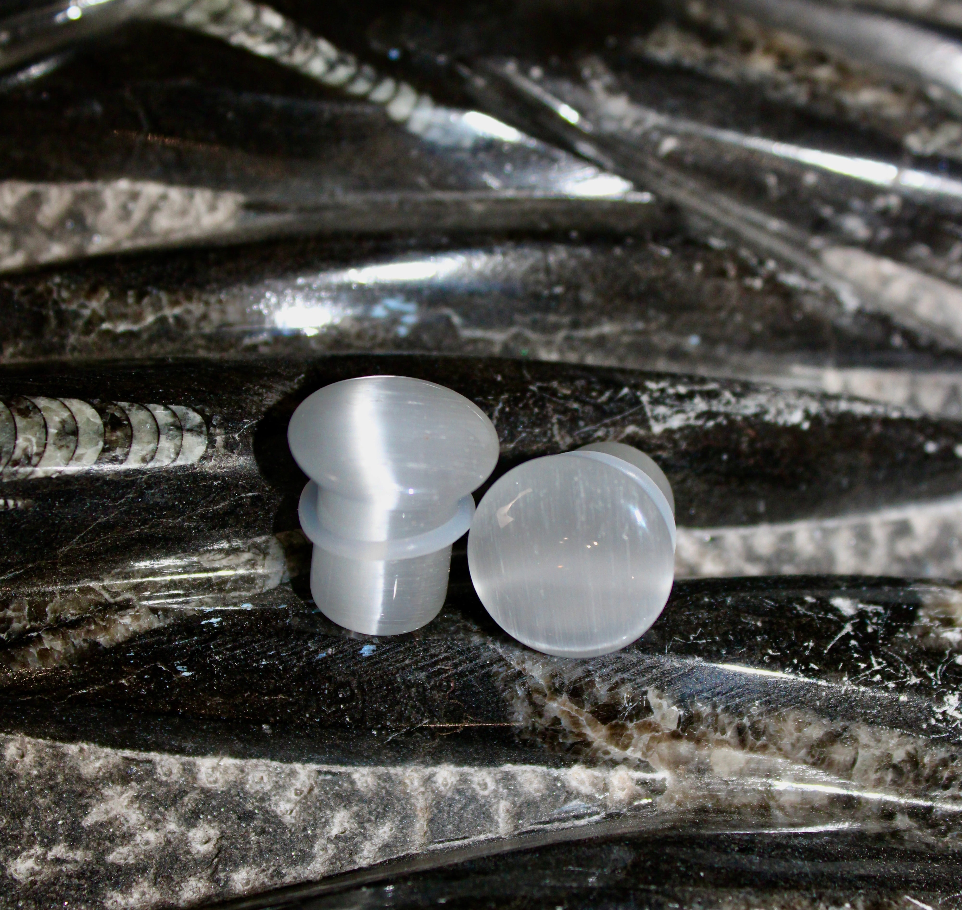 Chatoyant Line Silver Cat’s Eye glass is known for its sophisticated shimmer and ...