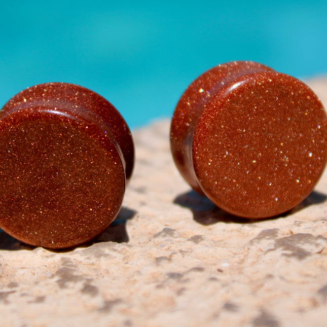 Goldstone double flared plugs organic glitter