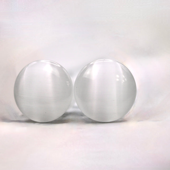 Polished white cat eye glass plugs with subtle chatoyancy and secure single flare design – perfect for everyday wear.