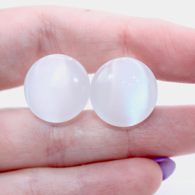 Polished white cat eye glass plugs with subtle chatoyancy and secure single flare design – perfect for everyday wear.