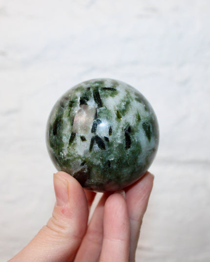 Green Tourmaline in Quartz Sphere - 57mm Stone Sphere with Plastic Display Stand Included - Green, White, and Black Stone Ball