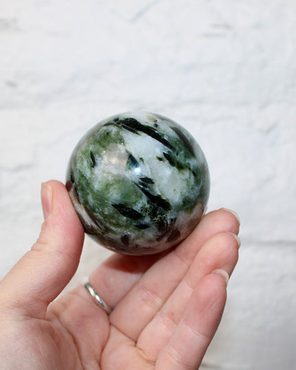 Green Tourmaline in Quartz Sphere - 57mm Stone Sphere with Plastic Display Stand Included - Green, White, and Black Stone Ball