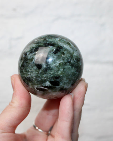 Green Tourmaline in Quartz Sphere - 57mm Stone Sphere with Plastic Display Stand Included - Green, White, and Black Stone Ball