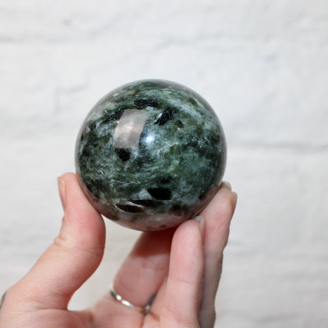 Green Tourmaline in Quartz Sphere - 57mm Stone Sphere with Plastic Display Stand Included - Green, White, and Black Stone Ball