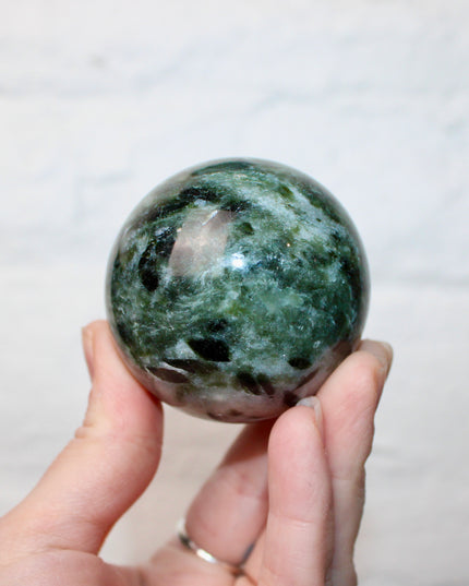 Green Tourmaline in Quartz Sphere - 57mm Stone Sphere with Plastic Display Stand Included - Green, White, and Black Stone Ball