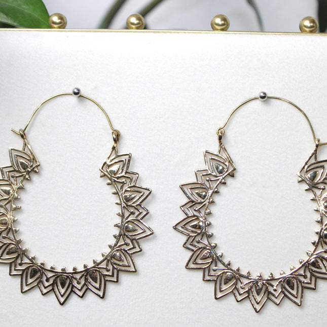 Elevate your stretched ear style with these stunning handmade gold brass ear weights, inspired by traditional Indian tribal mandala art. Crafted with care, each piece showcases intricate mandala detailing that adds a bold, spiritual elegance to any look.