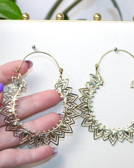 Elevate your stretched ear style with these stunning handmade gold brass ear weights, inspired by traditional Indian tribal mandala art. Crafted with care, each piece showcases intricate mandala detailing that adds a bold, spiritual elegance to any look.