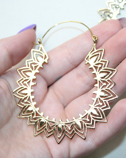 Elevate your stretched ear style with these stunning handmade gold brass ear weights, inspired by traditional Indian tribal mandala art. Crafted with care, each piece showcases intricate mandala detailing that adds a bold, spiritual elegance to any look.