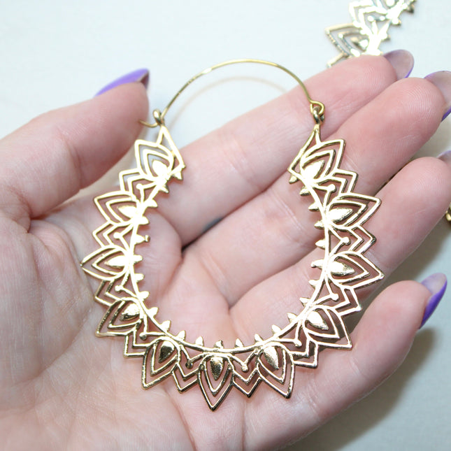 Elevate your stretched ear style with these stunning handmade gold brass ear weights, inspired by traditional Indian tribal mandala art. Crafted with care, each piece showcases intricate mandala detailing that adds a bold, spiritual elegance to any look.