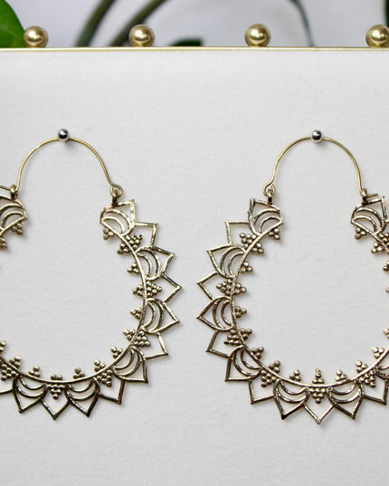 Elevate your stretched ear style with these stunning handmade gold brass ear weights, inspired by traditional Indian tribal mandala art. Crafted with care, each piece showcases intricate mandala detailing that adds a bold, spiritual elegance to any look.