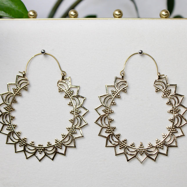 Elevate your stretched ear style with these stunning handmade gold brass ear weights, inspired by traditional Indian tribal mandala art. Crafted with care, each piece showcases intricate mandala detailing that adds a bold, spiritual elegance to any look.