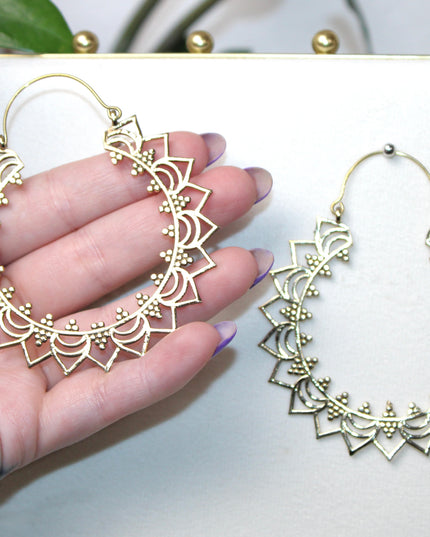 Elevate your stretched ear style with these stunning handmade gold brass ear weights, inspired by traditional Indian tribal mandala art. Crafted with care, each piece showcases intricate mandala detailing that adds a bold, spiritual elegance to any look.