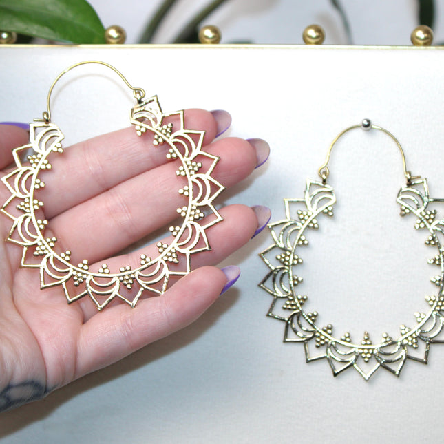 Elevate your stretched ear style with these stunning handmade gold brass ear weights, inspired by traditional Indian tribal mandala art. Crafted with care, each piece showcases intricate mandala detailing that adds a bold, spiritual elegance to any look.