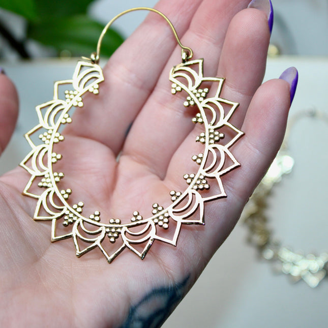 Elevate your stretched ear style with these stunning handmade gold brass ear weights, inspired by traditional Indian tribal mandala art. Crafted with care, each piece showcases intricate mandala detailing that adds a bold, spiritual elegance to any look.