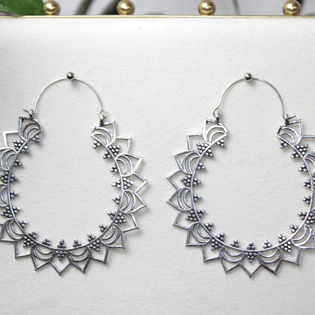 Elevate your stretched ear style with these stunning handmade silver brass ear weights, inspired by traditional Indian tribal mandala art. Crafted with care, each piece showcases intricate mandala detailing that adds a bold, spiritual elegance to any look.