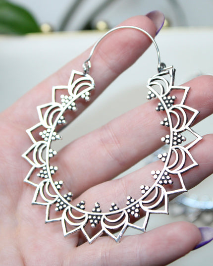 Elevate your stretched ear style with these stunning handmade silver brass ear weights, inspired by traditional Indian tribal mandala art. Crafted with care, each piece showcases intricate mandala detailing that adds a bold, spiritual elegance to any look.