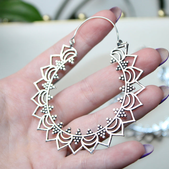 Elevate your stretched ear style with these stunning handmade silver brass ear weights, inspired by traditional Indian tribal mandala art. Crafted with care, each piece showcases intricate mandala detailing that adds a bold, spiritual elegance to any look.