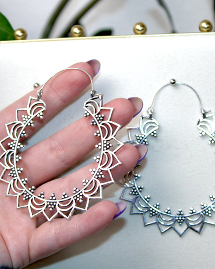Elevate your stretched ear style with these stunning handmade silver brass ear weights, inspired by traditional Indian tribal mandala art. Crafted with care, each piece showcases intricate mandala detailing that adds a bold, spiritual elegance to any look.