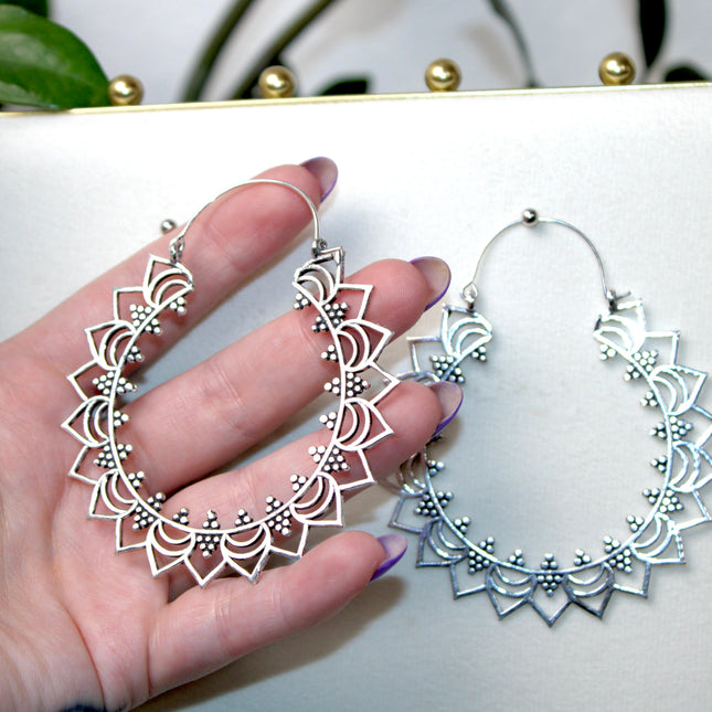 Elevate your stretched ear style with these stunning handmade silver brass ear weights, inspired by traditional Indian tribal mandala art. Crafted with care, each piece showcases intricate mandala detailing that adds a bold, spiritual elegance to any look.