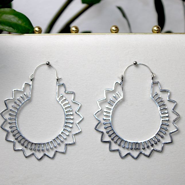 Elevate your stretched ear style with these stunning handmade silver brass ear weights, inspired by traditional Indian tribal mandala art. Crafted with care, each piece showcases intricate mandala detailing that adds a bold, spiritual elegance to any look.