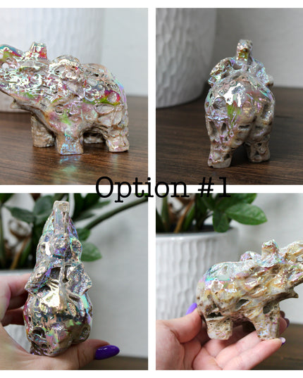 This Aura Quartz Elephant Carving features a charming hand-carved design enhanced with a brilliant rainbow electroplated finish. Made from natural quartz and treated to produce a luminous, color-shifting surface, this figurine blends natural beauty with a playful, eye-catching twist.