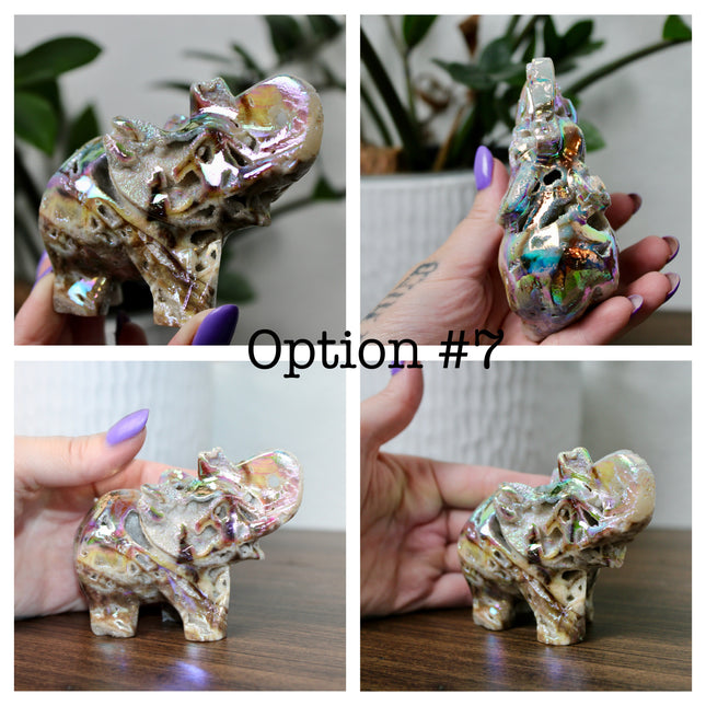 This Aura Quartz Elephant Carving features a charming hand-carved design enhanced with a brilliant rainbow electroplated finish. Made from natural quartz and treated to produce a luminous, color-shifting surface, this figurine blends natural beauty with a playful, eye-catching twist.