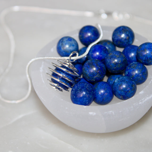 This Spiral Cage Crystal Sphere Necklace offers both beauty and function—allowing you to change out crystal spheres based on your energy or intention for the day. Whether you're seeking clarity, protection, calm, or empowerment, there’s a stone to support your journey.