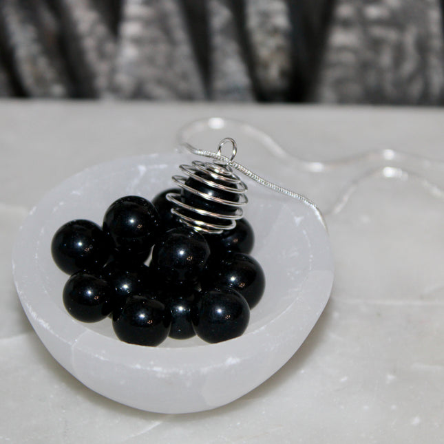 This Spiral Cage Crystal Sphere Necklace offers both beauty and function—allowing you to change out crystal spheres based on your energy or intention for the day. Whether you're seeking clarity, protection, calm, or empowerment, there’s a stone to support your journey.