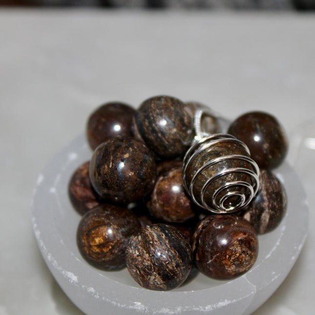 This Spiral Cage Crystal Sphere Necklace offers both beauty and function—allowing you to change out crystal spheres based on your energy or intention for the day. Whether you're seeking clarity, protection, calm, or empowerment, there’s a stone to support your journey.