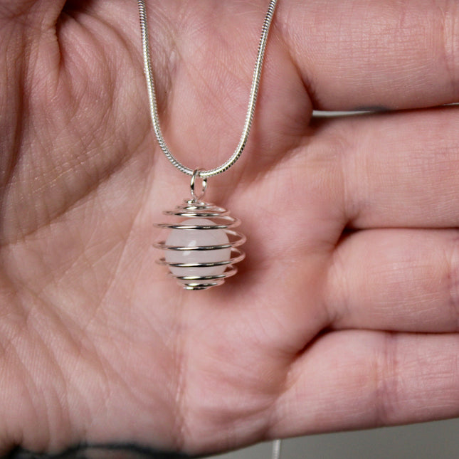 This Spiral Cage Crystal Sphere Necklace offers both beauty and function—allowing you to change out crystal spheres based on your energy or intention for the day. Whether you're seeking clarity, protection, calm, or empowerment, there’s a stone to support your journey.
