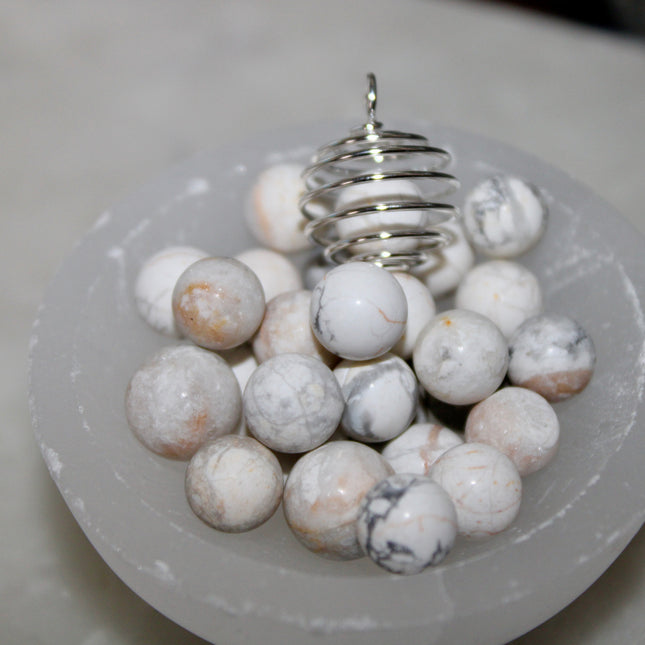 This Spiral Cage Crystal Sphere Necklace offers both beauty and function—allowing you to change out crystal spheres based on your energy or intention for the day. Whether you're seeking clarity, protection, calm, or empowerment, there’s a stone to support your journey.