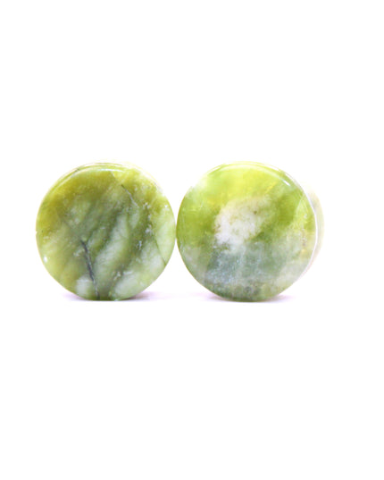 These double flare plugs are crafted from authentic South Jade, a naturally green stone known for its smooth texture and subtle color variations. Hand-polished for a glossy finish, each plug is shaped for comfortable daily wear while showcasing the calming, earthy tones of the stone.