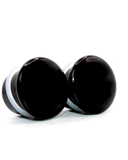 These Black Obsidian Single Flare Plugs are carved from genuine volcanic glass and polished for a bold, minimalist look. The secure single flare design with O-rings ensures comfortable, everyday wear for stretched lobes.