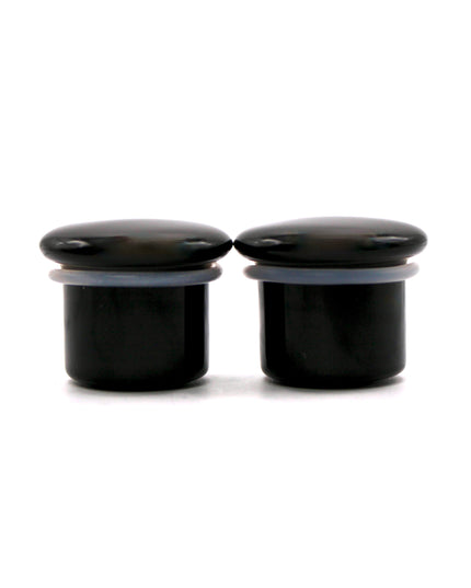 These Black Obsidian Single Flare Plugs are carved from genuine volcanic glass and polished for a bold, minimalist look. The secure single flare design with O-rings ensures comfortable, everyday wear for stretched lobes.