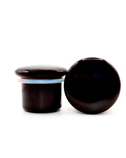 These Black Obsidian Single Flare Plugs are carved from genuine volcanic glass and polished for a bold, minimalist look. The secure single flare design with O-rings ensures comfortable, everyday wear for stretched lobes.
