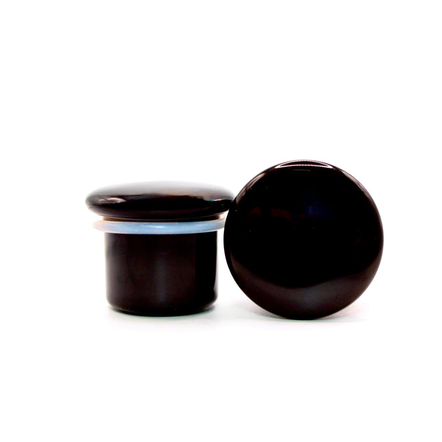 These Black Obsidian Single Flare Plugs are carved from genuine volcanic glass and polished for a bold, minimalist look. The secure single flare design with O-rings ensures comfortable, everyday wear for stretched lobes.