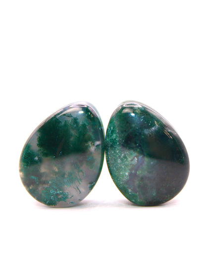 These Moss Agate Tear Drop Plugs are hand-carved from genuine moss agate, showcasing unique green hues and natural, moss-like patterns within the stone. The tear drop shape offers a stylish alternative to traditional round plugs, and the double flare design ensures a secure, comfortable fit without the need for O-rings.