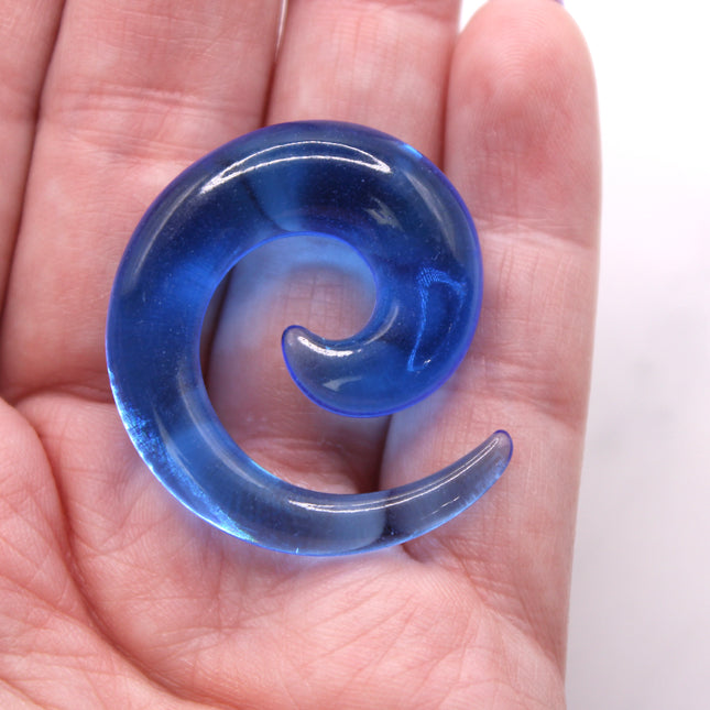 These Blue Acrylic Spiral Tapers offer a bold, colorful twist to your stretched ear collection. With their vibrant blue tone and swirling design, they’re perfect for adding movement and personality to your look. Made from lightweight acrylic, they’re easy to wear and ideal for daily use or special occasions.
