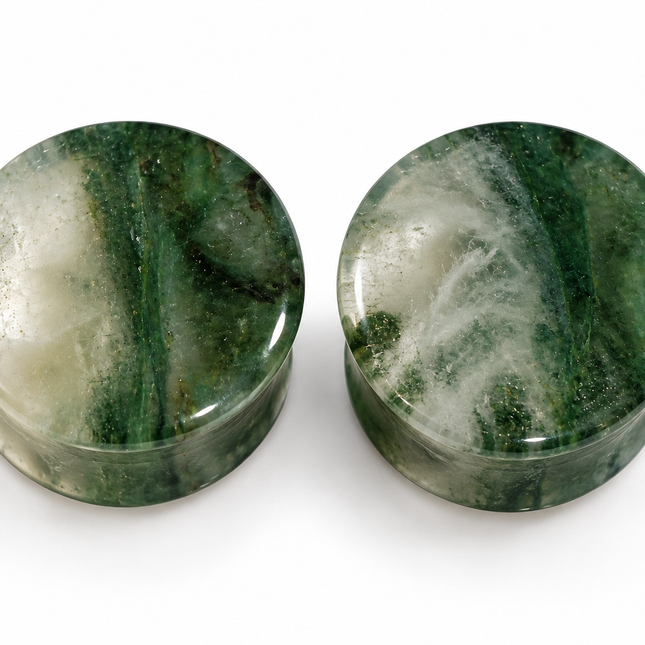 Two round green stone plugs with natural marbled patterns, displayed side-by-side on a white background.