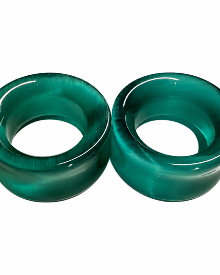Two green translucent plug earrings with a glossy finish, displayed side-by-side on a plain white background.