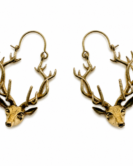 A pair of antique gold-toned deer head hoop earrings with intricate antlers and dangling hooks, shown on a plain white background.