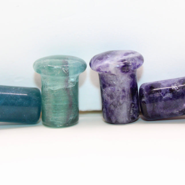 Fluorite single flare plugs is a highly protective and mentally uplifting stone, known for enhancing clarity, focus, and spiritual alignment. Often connected to the third eye and crown chakras, it helps cleanse negative energy and bring calm, balanced thinking. The stunning bands of purple, green, and clear make it as visually striking as it is energetically supportive.