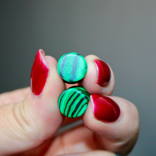 These Green and Black Synthetic Malachite Double Flare Plugs are perfect for anyone seeking a bold, polished look with nature-inspired vibes—great for everyday wear or completing your crystal-themed plug collection.