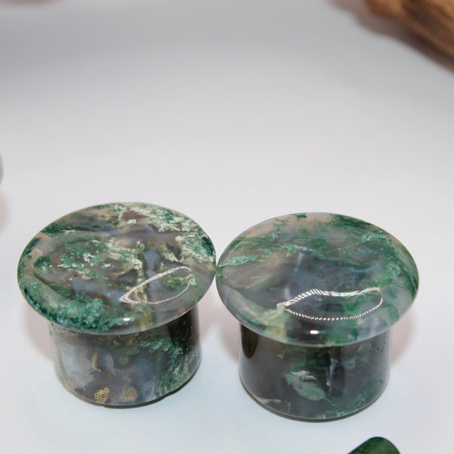 These Grade A Moss Agate Single Flare Plugs offer both comfort and crystal energy in one elegant pair. Ideal for nature lovers, energy workers, or anyone who appreciates the earthy charm of natural stone jewelry.