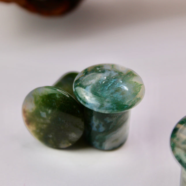 These Grade A Moss Agate Single Flare Plugs offer both comfort and crystal energy in one elegant pair. Ideal for nature lovers, energy workers, or anyone who appreciates the earthy charm of natural stone jewelry.