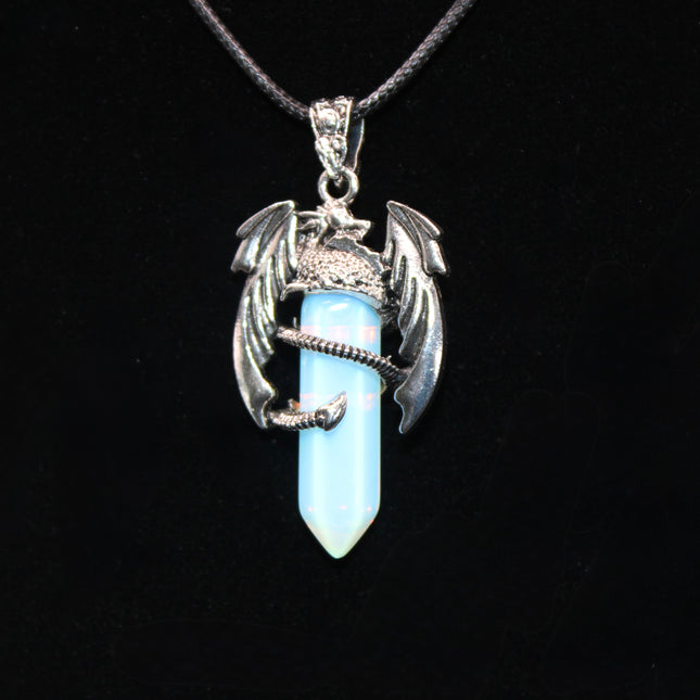 A fierce and enchanting Dragon Necklace with Opalite brings fantasy to life, featuring a detailed dragon wrapped protectively around a glowing opalite orb. The iridescent stone shimmers with soft hues of blue, lavender, and pearly white, catching light with a mystical glow. The dragon pendant is crafted with intricate scales and wings, giving it a bold, medieval-inspired aesthetic.