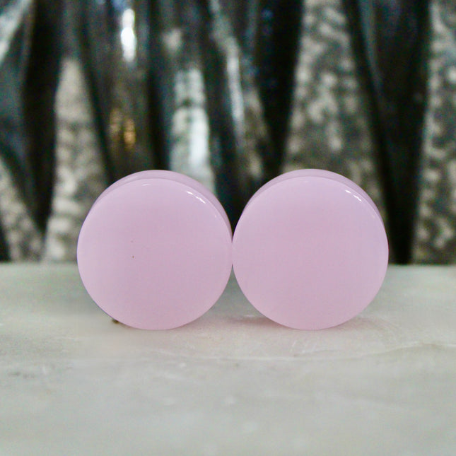 These Pink Agate Double Flare Plugs combine crystal healing with bold color and natural elegance—perfect for everyday wear or adding a soft, grounding energy to your stretched ear style.