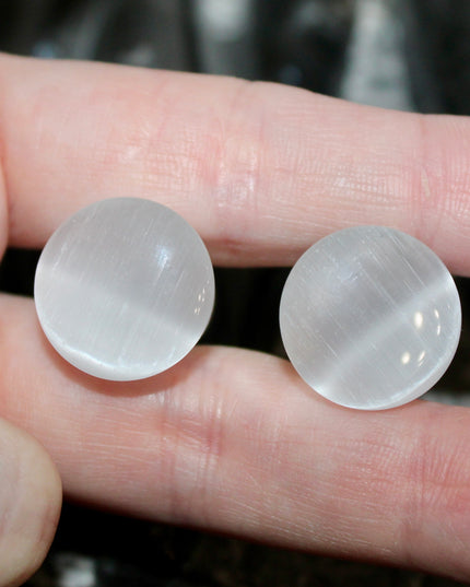 Silver Cat’s Eye glass is known for its sophisticated shimmer and luminous, moving line—known as chatoyancy—that dances across the surface like a beam of light. The cool, metallic tone represents clarity, balance, and subtle strength, making it a versatile choice for everyday wear or a sleek accent piece.